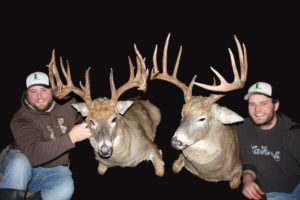 These brothers took giant bucks on the same hunt with Alberta's North River Outfitters. 