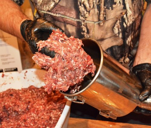 Once ground and seasoned, meat can be pressed into casings for storage and preparation.