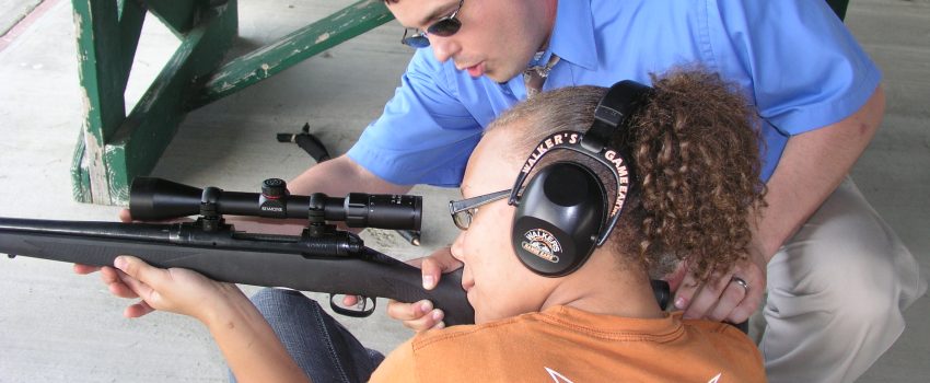 Girl shooting, Camp Compass Academy